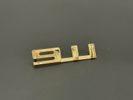 Original  911"-Plakette gold 